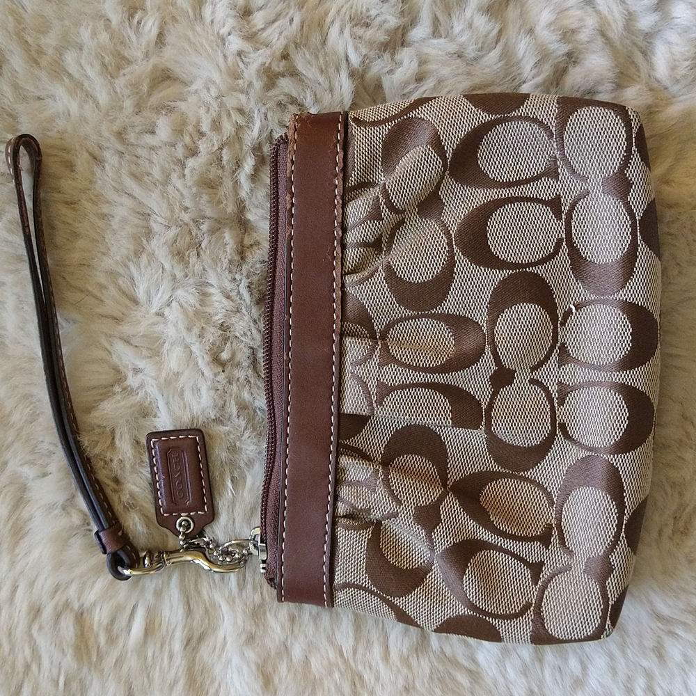 GUC Coach wristlet.